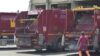 Mezzi Ama con netturbini a lavoro a Roma